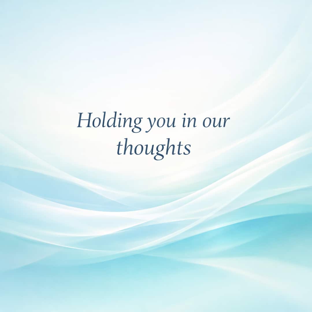 holding you in our thoughts sympathy message on soft abstract light background