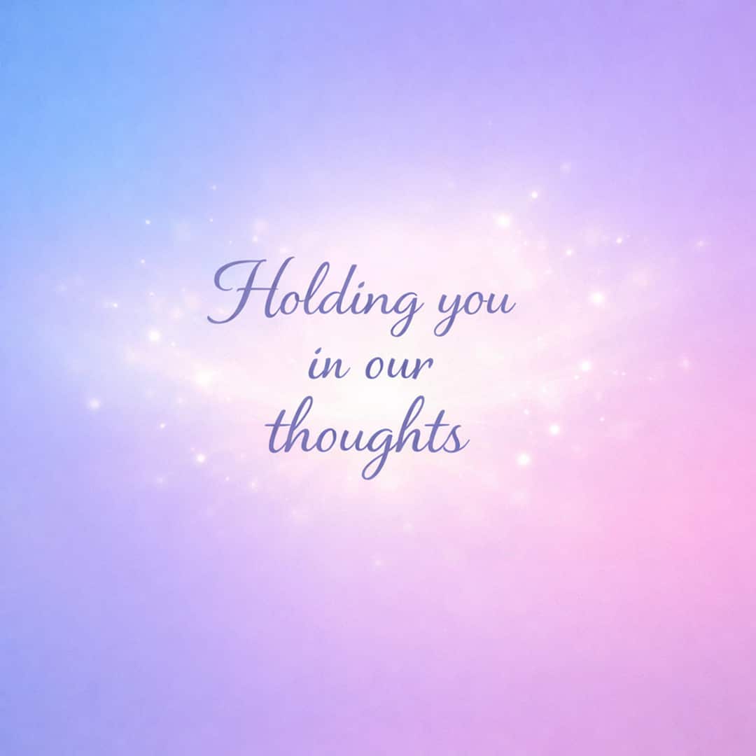 holding you in our thoughts sympathy message on glowing pastel gradient background