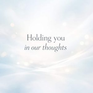 holding you in our thoughts sympathy message on soft abstract light background