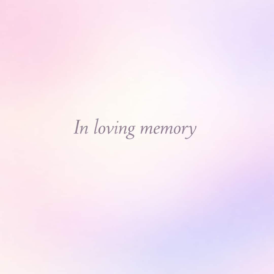 in loving memory sympathy message on soft pastel gradient background
