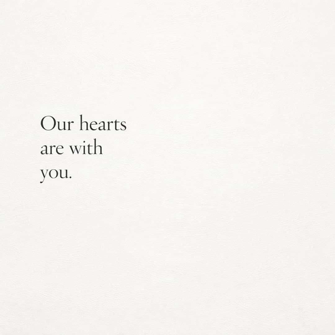 our hearts are with you sympathy message on minimal soft beige background