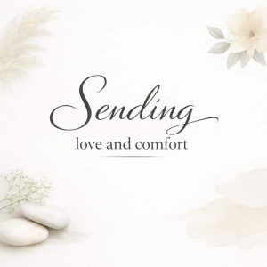 sending love and comfort sympathy message on soft light background with stones