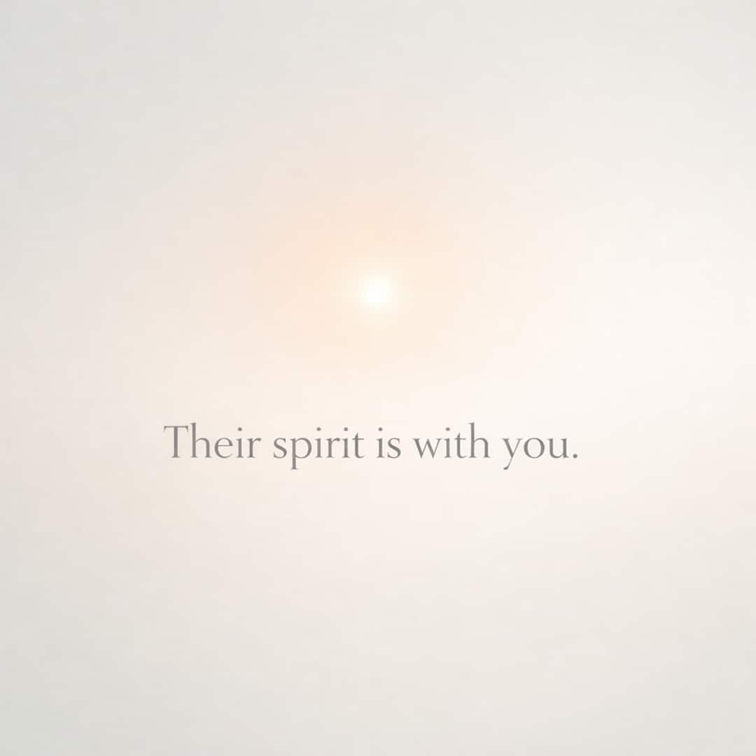 their spirit is with you sympathy message on soft glowing light background