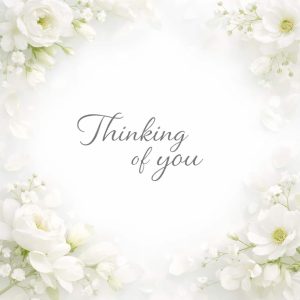 thinking of you sympathy message with white floral frame on light background