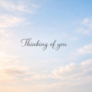 thinking of you sympathy message on soft sky background with clouds