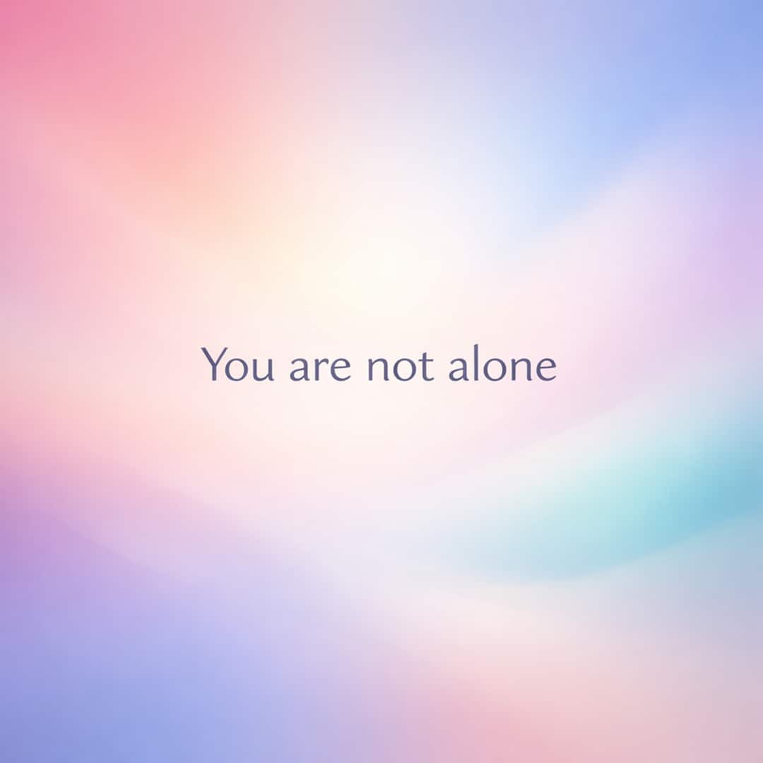 you are not alone sympathy message on glowing pastel gradient background