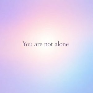 you are not alone sympathy message on soft pastel gradient background