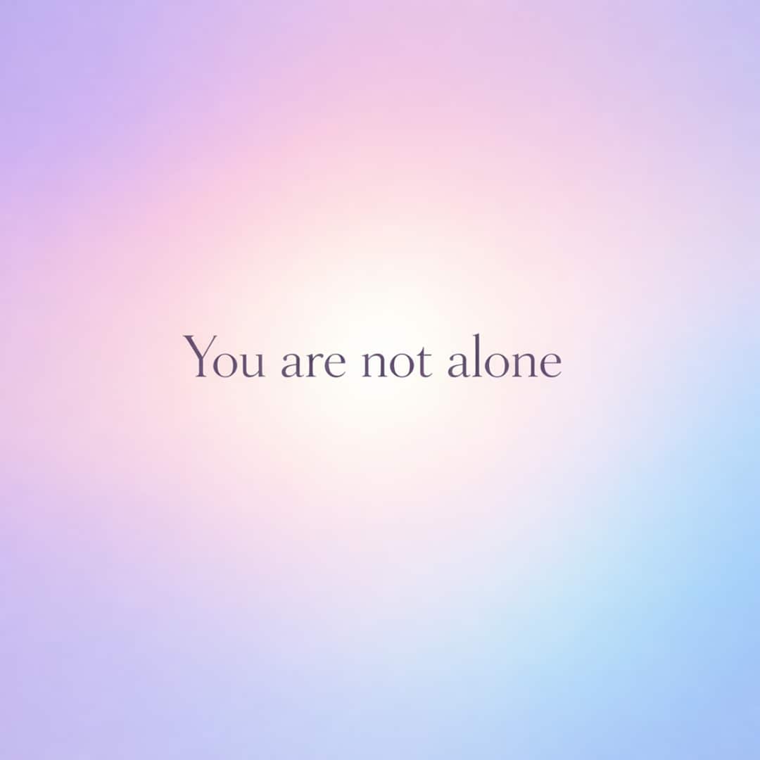 you are not alone sympathy message on soft pastel gradient background